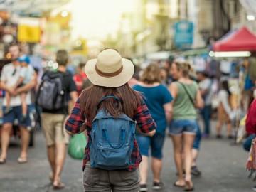 Back side of Young Asian traveling women walking and looking in Khaosan Road